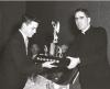 Archbishop MacNeil presenting a trophy to a young man