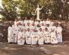 Large group of clergy with then,  Rev. Thomas Collins seated in the front row, fourth from the left