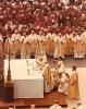 Pope John Paul II celebrating Mass in Rome, Archbishop MacNeil visible among the bishops