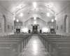 Interior of Immaculate Conception Church showing length of pews to the altar (prior to the installation of the organ)