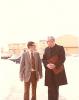 Archbishop MacNeil walking outside with unidentified man