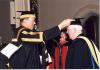 Archbishop MacNeil receiving an honorary degree  from Cardinal Ambrozic at the Pontifical Institute of Mediaeval Studies