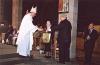 Archbishop Collins presenting an award and a gift to Sister Annata Brockman at St. Joseph's Basilica