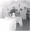 Rev. Paul O'Reilly cutting a cake
