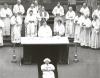 Priests gathered around the altar during the Funeral Mass for Archbishop Anthony Jordan at St. Joseph's Cathedral