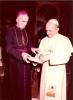 Archbishop MacNeil and Pope Paul VI standing together looking at a book when Archbishop MacNeil was in Rome to receive the Pallium