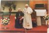 Pope John Paul II speaking in front of the altar with Archbishop MacNeil seated
