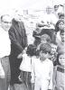 Archbishop Jordan standing with group of local children in Peru