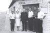 Archbishop Jordan standing with five mission volunteers in front of a Church in Peru