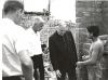 Archbishop Jordan speaking with a young man and mission volunteers in Peru