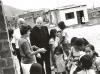Archbishop Jordan with mission workers and a  group of children in Peru