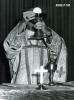 Archbishop Jordan elevating the Body and Blood of Christ
