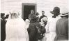 Archbishop O'Leary with people gathered outside a church