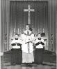 Rev. Raymond Sevigny with two altar boys