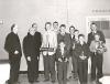 Group photograph of several young men holding trophies
